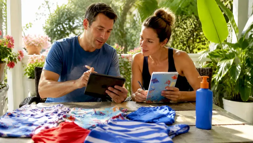 Parents scheduling swim lessons at home