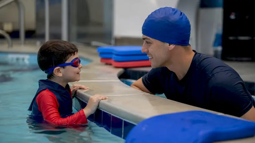 Child receiving one-on-one swim instruction