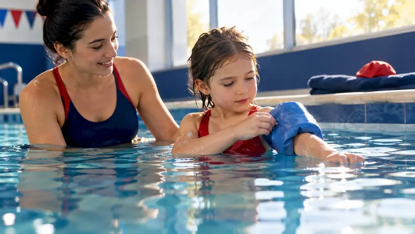 Child practicing without fully inflated floaties