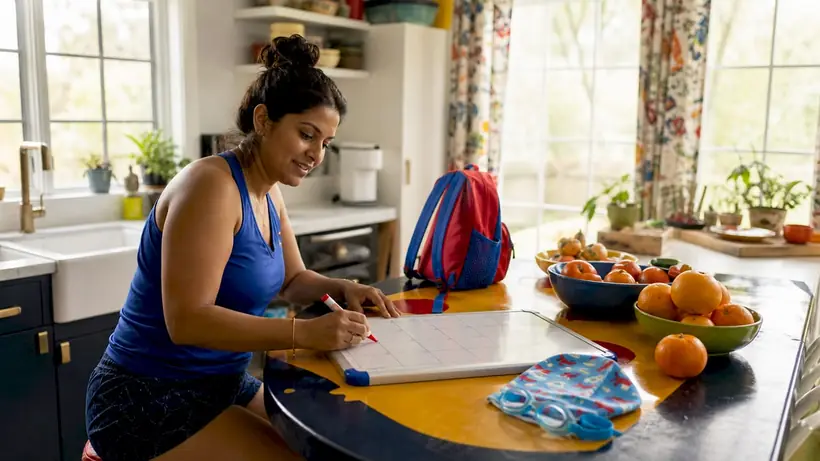 Parent organizing swim lesson schedule