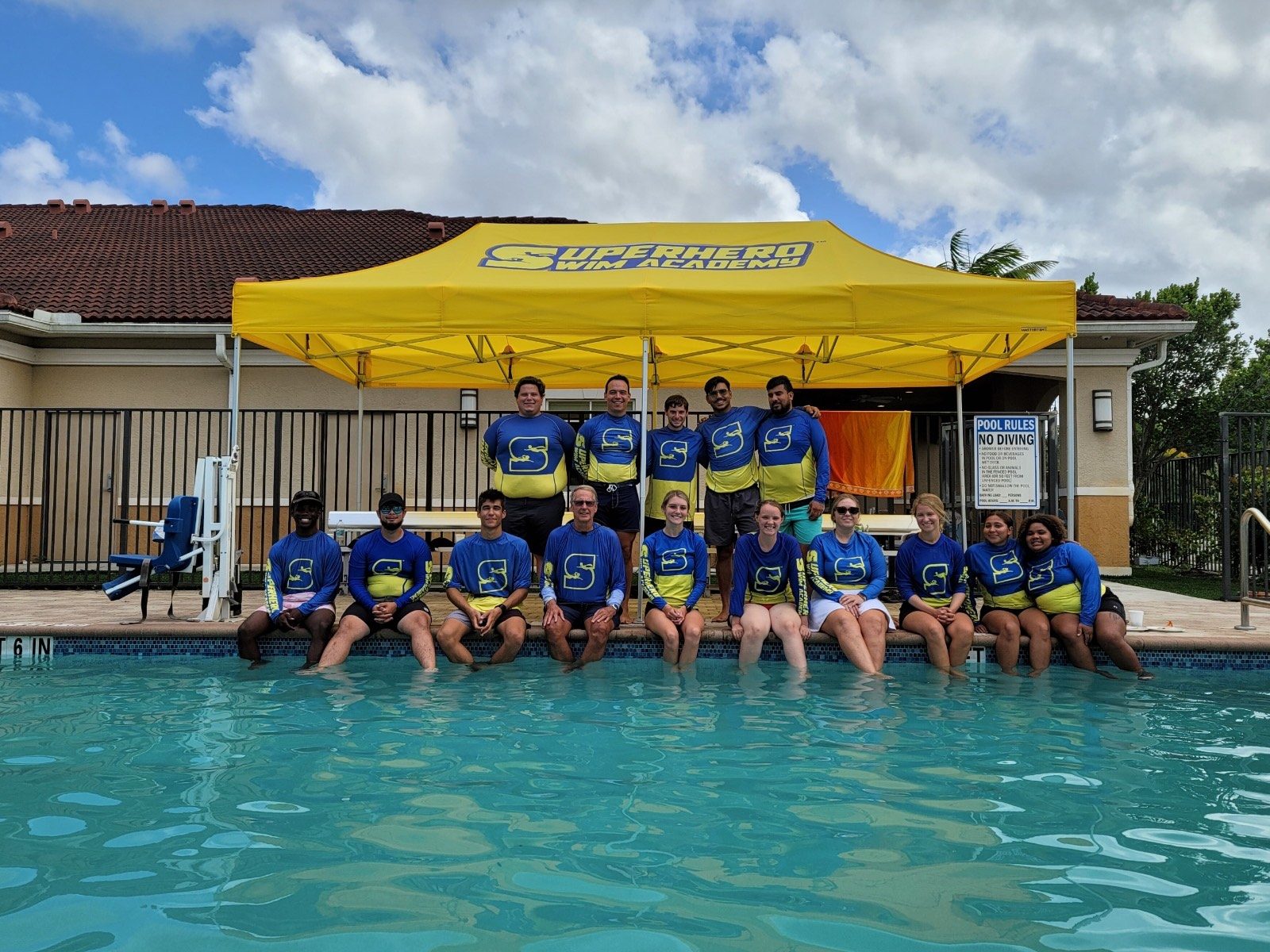 The Superhero Swim Academy coaching team at the poolside
